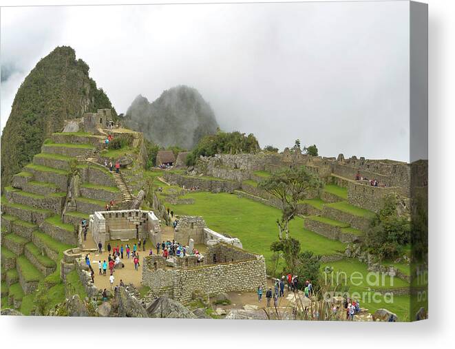 Peru Canvas Print featuring the photograph Machu Picchu in the clouds by Ksenia VanderHoff