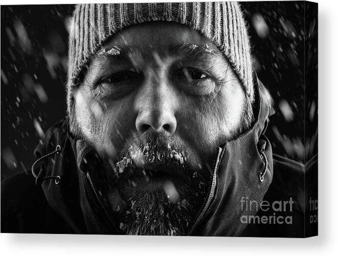 Snow Canvas Print featuring the photograph Man freezing in snow storm close up by Simon Bratt