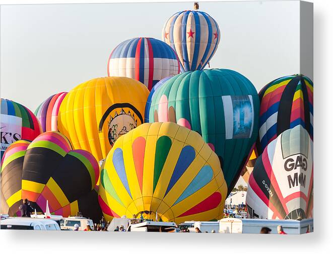 Hot Air Balloons Canvas Print featuring the photograph Massive colors by Charles McCleanon