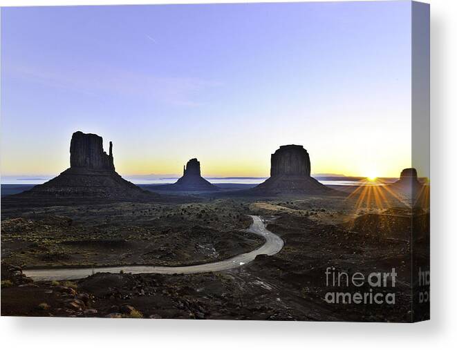 Valley Canvas Print featuring the photograph Monument Valley at Sunrise by Peter Dang