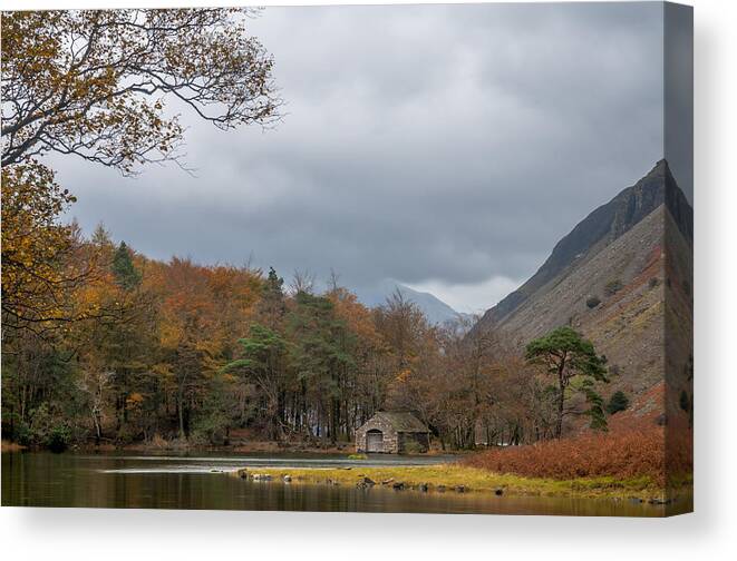 Autumn Canvas Print featuring the photograph Moody clouds over a boathouse on Wast Water in the Lake District by Neil Alexander Photography