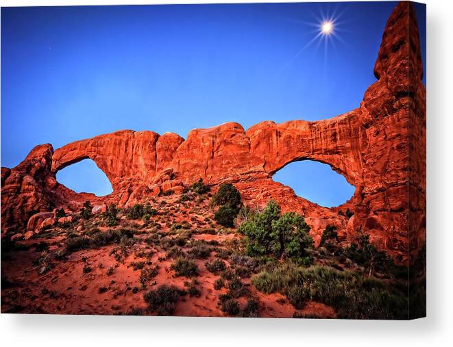 Arches Canvas Print featuring the photograph Moon Flares Over Windows by Mike Stephens
