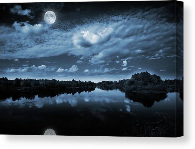 Beautiful Canvas Print featuring the photograph Moonlight over a lake by Jaroslaw Grudzinski