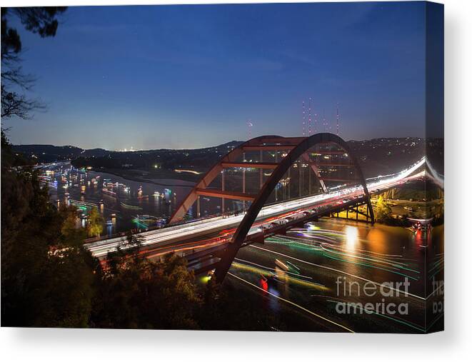 Nighttime Canvas Print featuring the photograph Nighttime boats leave colorful streaks as they cruise up and dow by Dan Herron