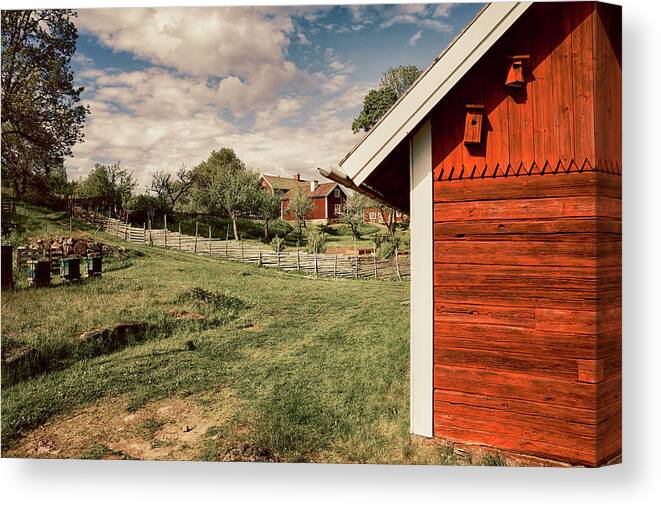 Farm Canvas Print featuring the photograph Old Red Farm Set In A Rural Nature Landscape by Christian Lagereek