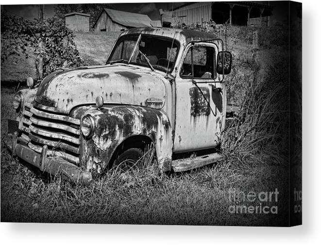 Paul Ward Canvas Print featuring the photograph Old Rusty Chevy in black and white by Paul Ward