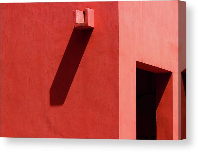 Minimal Canvas Print featuring the photograph Open Door and Water Outlet on a red wall by Prakash Ghai