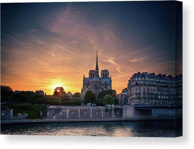 Notre Canvas Print featuring the photograph Paris, Notre Dame Cathedral at sunset by Sergey Taran