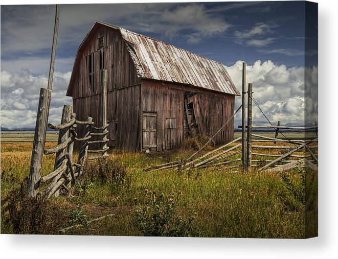 Wood Canvas Print featuring the photograph Red Barn with Wood Fence on an Abandoned Farm by Randall Nyhof