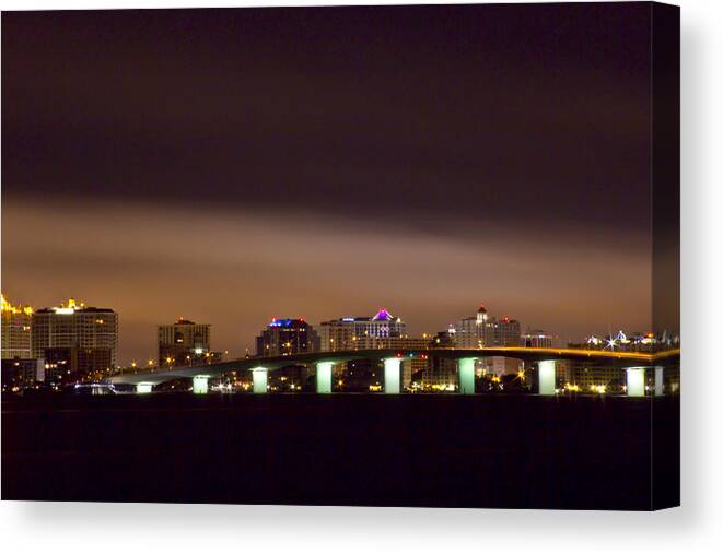 The John Ringling Bridge And The Sarasota City With Night Time Clouds Lit Up By The City Lights Architecture Canvas Print featuring the photograph Ringling Bridge and Sarasota by Nicholas Evans