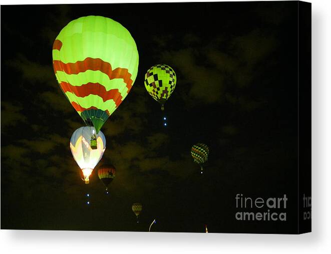 Hot Air Balloons Canvas Print featuring the photograph Rising in early dawn by Jeff Swan
