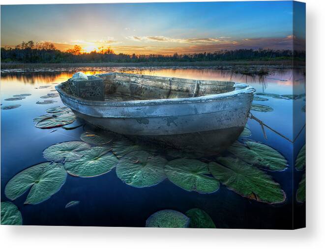 Boats Canvas Print featuring the photograph Rowboat at Sunset by Debra and Dave Vanderlaan