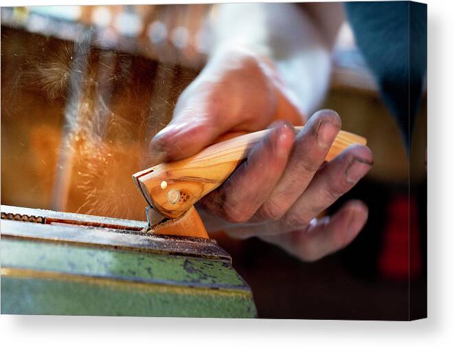 Forged In Fire Canvas Print featuring the photograph Sharpening the Blade by Jean Gill