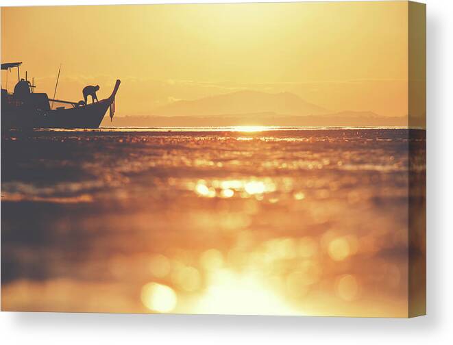 Background Canvas Print featuring the photograph Silhouette of a Thai fisherman wooden boat longtail during beautiful sunrise by Srdjan Kirtic