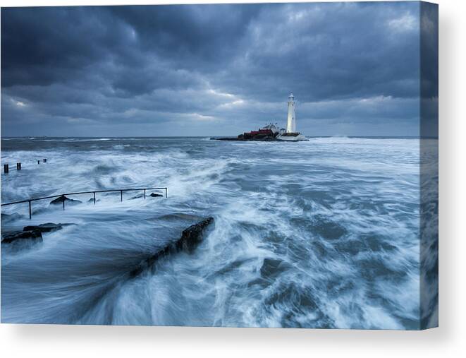 St Mary's Lighthouse Canvas Print featuring the photograph St Mary's Lighthouse and the cold North Sea by Anita Nicholson