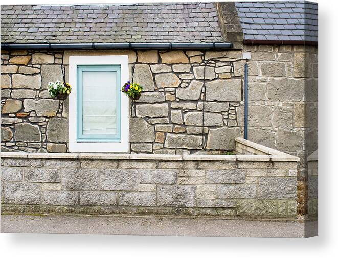 Aged Canvas Print featuring the photograph Stone cottage by Tom Gowanlock