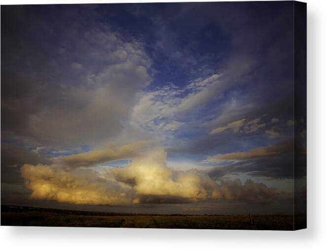 Landscape Canvas Print featuring the photograph Stormy Sunset by Toni Hopper