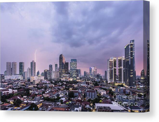 Capital Cities Canvas Print featuring the photograph Stunning sunset over Jakarta, Indonesia capital city by Didier Marti