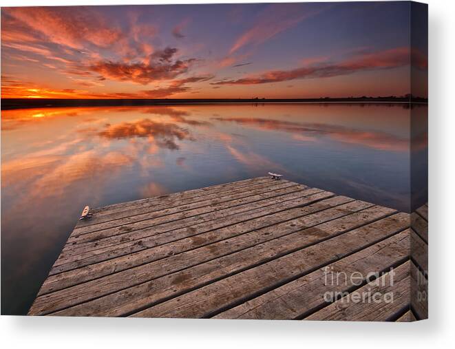 Sunrise Canvas Print featuring the photograph Sunrise over a Colorado fishing dock by Ronda Kimbrow