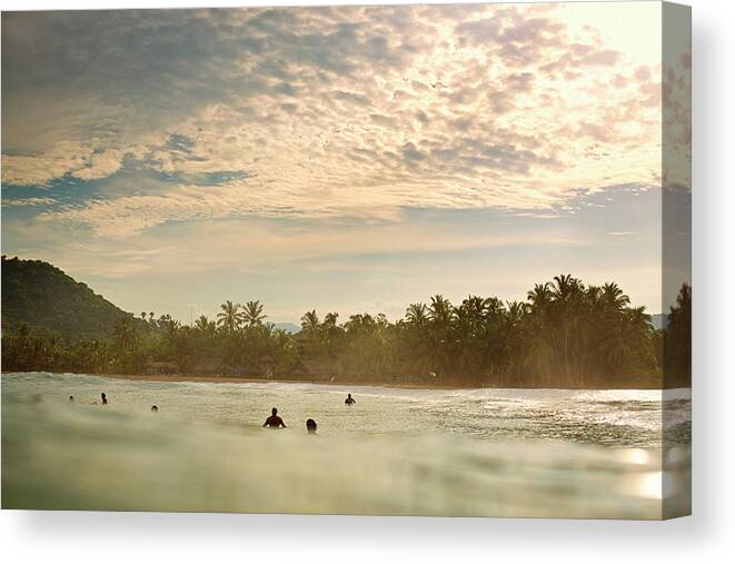 Surfing Canvas Print featuring the photograph Sunrise Surfers by Nik West