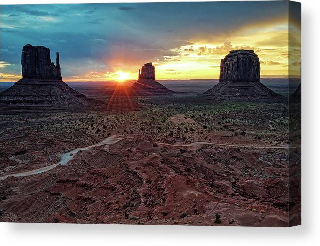Monument Valley Canvas Print featuring the photograph Sunset at Monument Valley Navajo Tribal Park Three Mittens Arizona by Silvio Ligutti