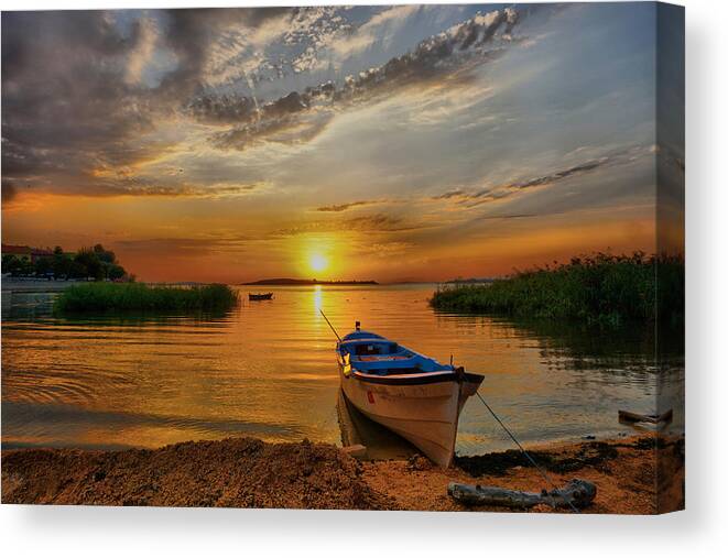 Sunset Canvas Print featuring the photograph Sunset over lake by Lilia D