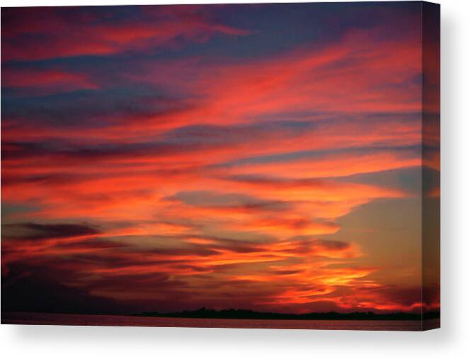 Sunset Over Water Canvas Print featuring the photograph Sunset Sky by Sally Weigand