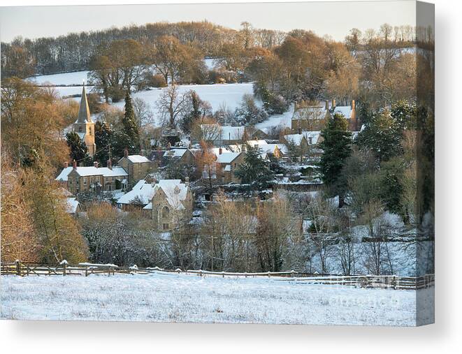 Swerford Canvas Print featuring the photograph Swerford Village in the Winter Snow by Tim Gainey