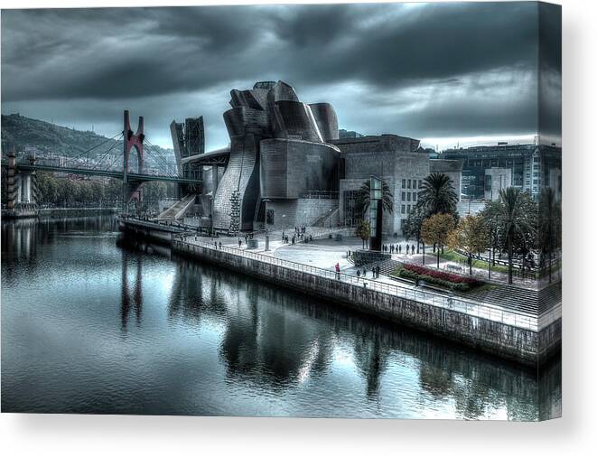 Spain Bilbao Guggenheim Museum Basque Country Frank Gehry Contemporary Architecture Nervion River City Daring And Innovative Curves Building Exterior Spectacular Building Deconstructivism Ferrovial Clad In Glass Canvas Print featuring the photograph The Guggenheim Museum Bilbao Surreal by Andy Myatt