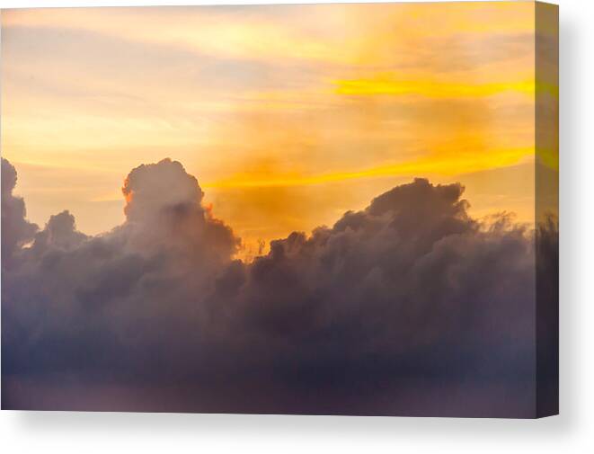 Sunsets Canvas Print featuring the photograph The sky ablaze by Charles McCleanon