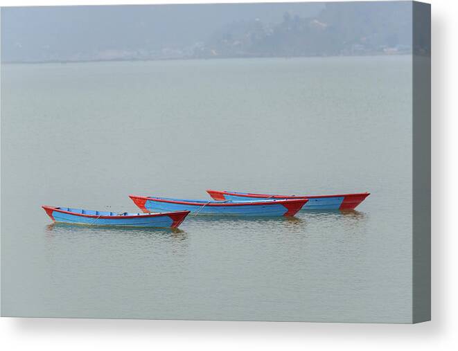 Boat Canvas Print featuring the photograph Three blue boats on Phewa Lake in Pokhara by Dutourdumonde Photography