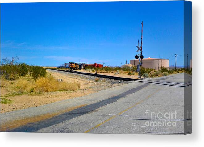 Railway Crossing; Railroad Crossing; Train Crossing; Union Pacific; Freight Train; Yellow; Blue; Green; Red; Water Storage; Train Tracks; Train Signal; Mojave Desert; Mohave Desert; Antelope Valley; Joe Lach Canvas Print featuring the photograph Train Loop by Joe Lach
