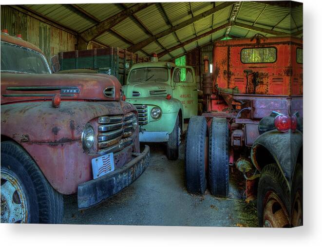 Trucks Canvas Print featuring the photograph Truck Graveyard Warehouse by Jerry Gammon