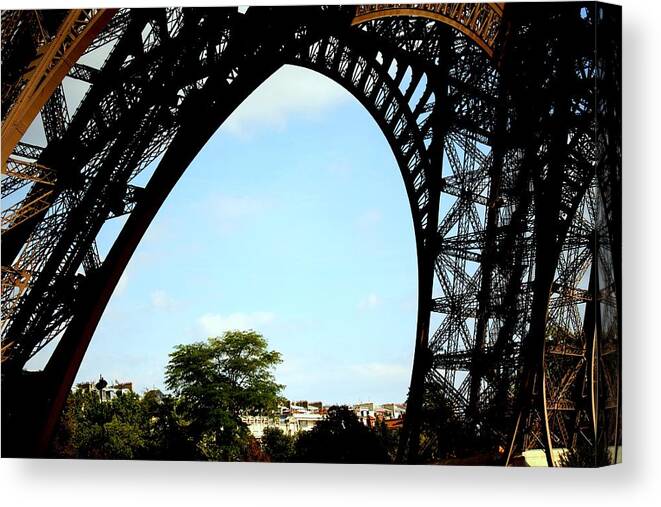 Eiffel Tower Canvas Print featuring the photograph Under the Eiffel Tower by Chuck Kuhn