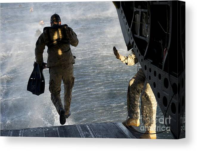 Soldier Canvas Print featuring the photograph U.s. Army Green Beret Exits A Ch-47 by Stocktrek Images