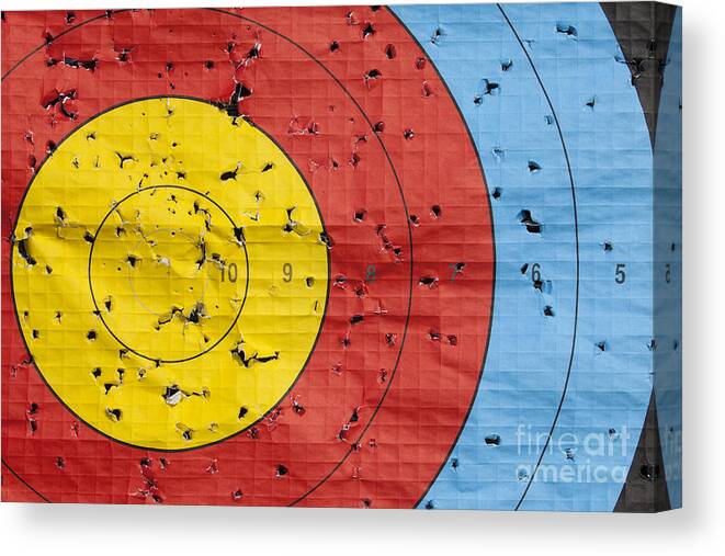 Archery Canvas Print featuring the photograph Used archery target close up by Simon Bratt