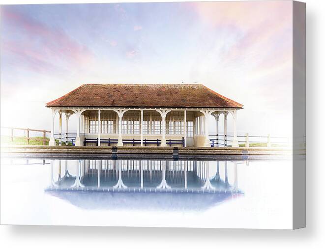 Sheringham Canvas Print featuring the photograph Norfolk victorian seaside shelter with pink sunset sky by Simon Bratt