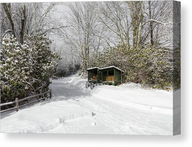 Snow Canvas Print featuring the photograph Wagon Wheels and Firewood by D K Wall