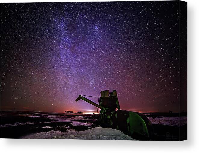 Astroscape Skyscape Night Stars Milky Way Landscape Starscape Combine Harvester Nd Snow Winter Orion North Dakota Cold Purple Green John Deere Canvas Print featuring the photograph Waiting for Next Harvest by Peter Herman