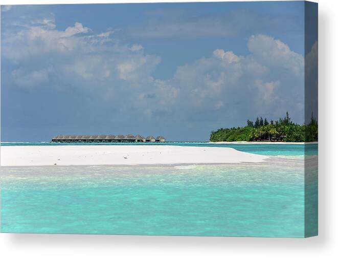 Jenny Rainbow Fine Art Photography Canvas Print featuring the photograph Water Bungalows of Maldivian Resort by Jenny Rainbow