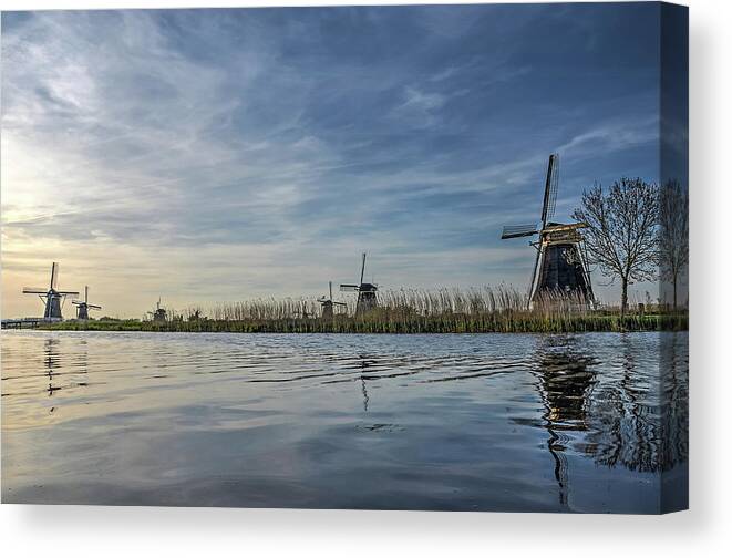 Kinderdijk Canvas Print featuring the photograph Windmill Reflecting in Kinderdijk Canal by Frans Blok