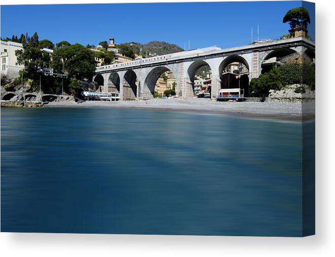 Zoagli Canvas Print featuring the photograph Zoagli Smooth Waves Beach With Train Bridge by Enrico Pelos