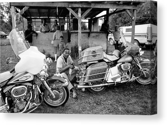 Sitting Canvas Print featuring the photograph Black Motorcyclists #1 by John Shearer