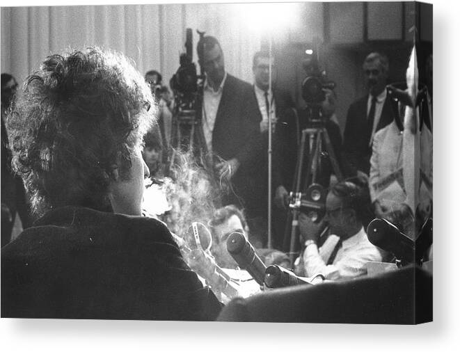 Music Canvas Print featuring the photograph Dylan At A Press Conference In Los #1 by Michael Ochs Archives