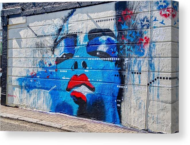 Graffiti Canvas Print featuring the photograph Graffiti Art Painting Of Blue Woman #1 by Raymond Hill