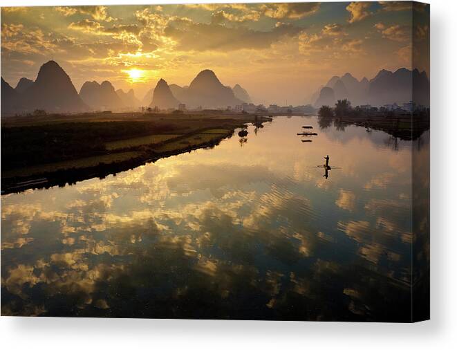 Yangshuo Canvas Print featuring the photograph Karst Mountains And Fisherman On Raft #1 by Richard I'anson