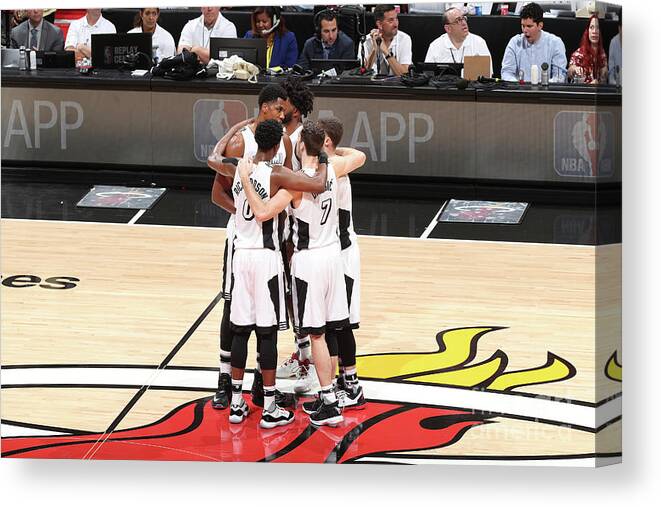 The Miami Heat Huddle Before A Game Against The Los Angeles Lakers On December 22 Canvas Print featuring the photograph Los Angeles Lakers V Miami Heat #1 by Joe Murphy