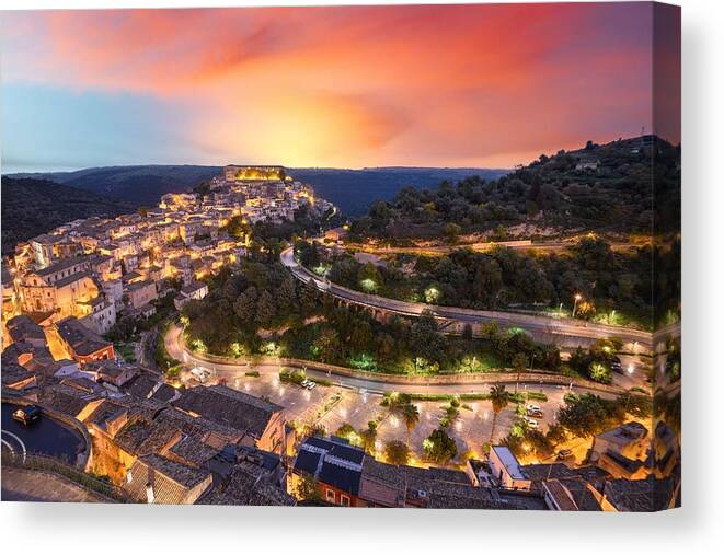 Landscape Canvas Print featuring the photograph Ragusa Ibla, Italy Town View At Dusk #1 by Sean Pavone