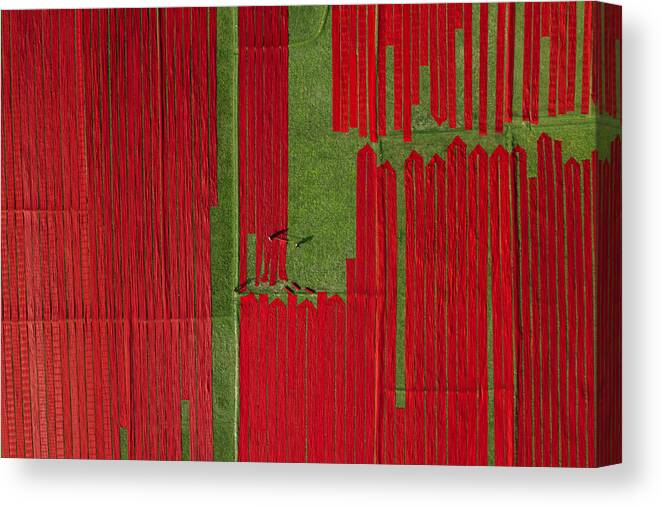 Dyed Canvas Print featuring the photograph Red Fabrics #1 by Azim Khan Ronnie