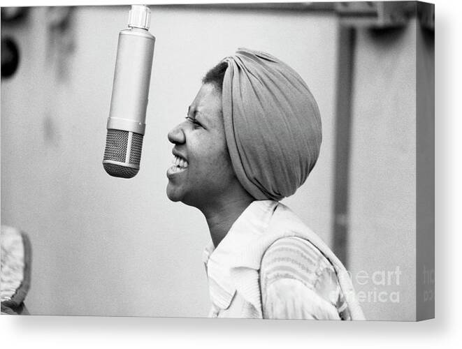 Music Canvas Print featuring the photograph Soul Singer Aretha Franklin Records #1 by The Estate Of David Gahr